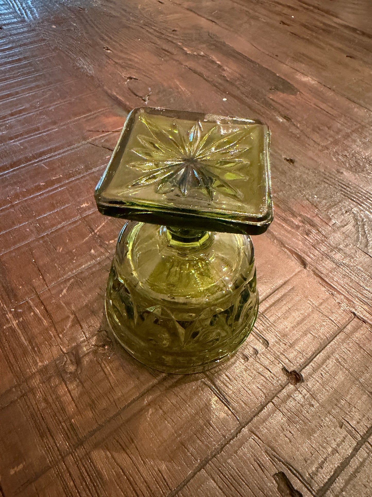 A mid-century green pressed glass goblet by Indiana Glass.