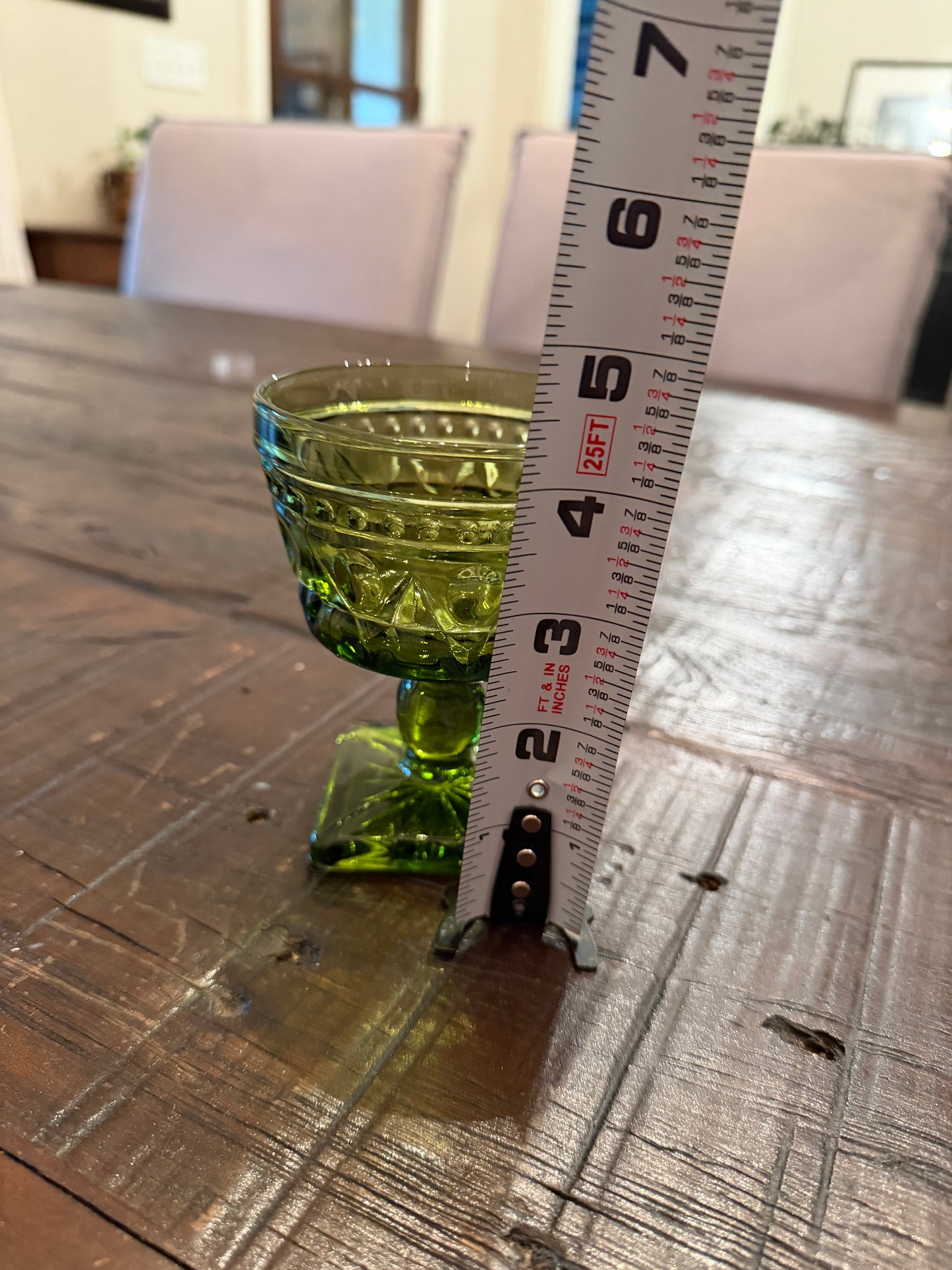 A mid-century  green pressed glass goblet by Indiana Glass.