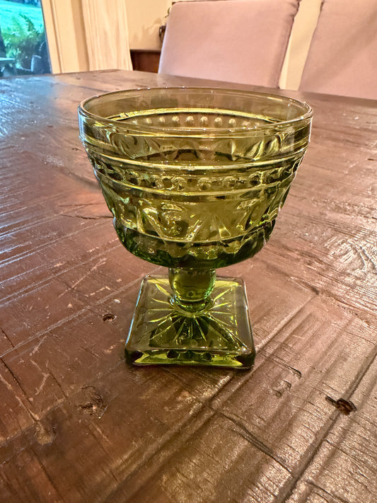 A mid-century  green pressed glass goblet by Indiana Glass.