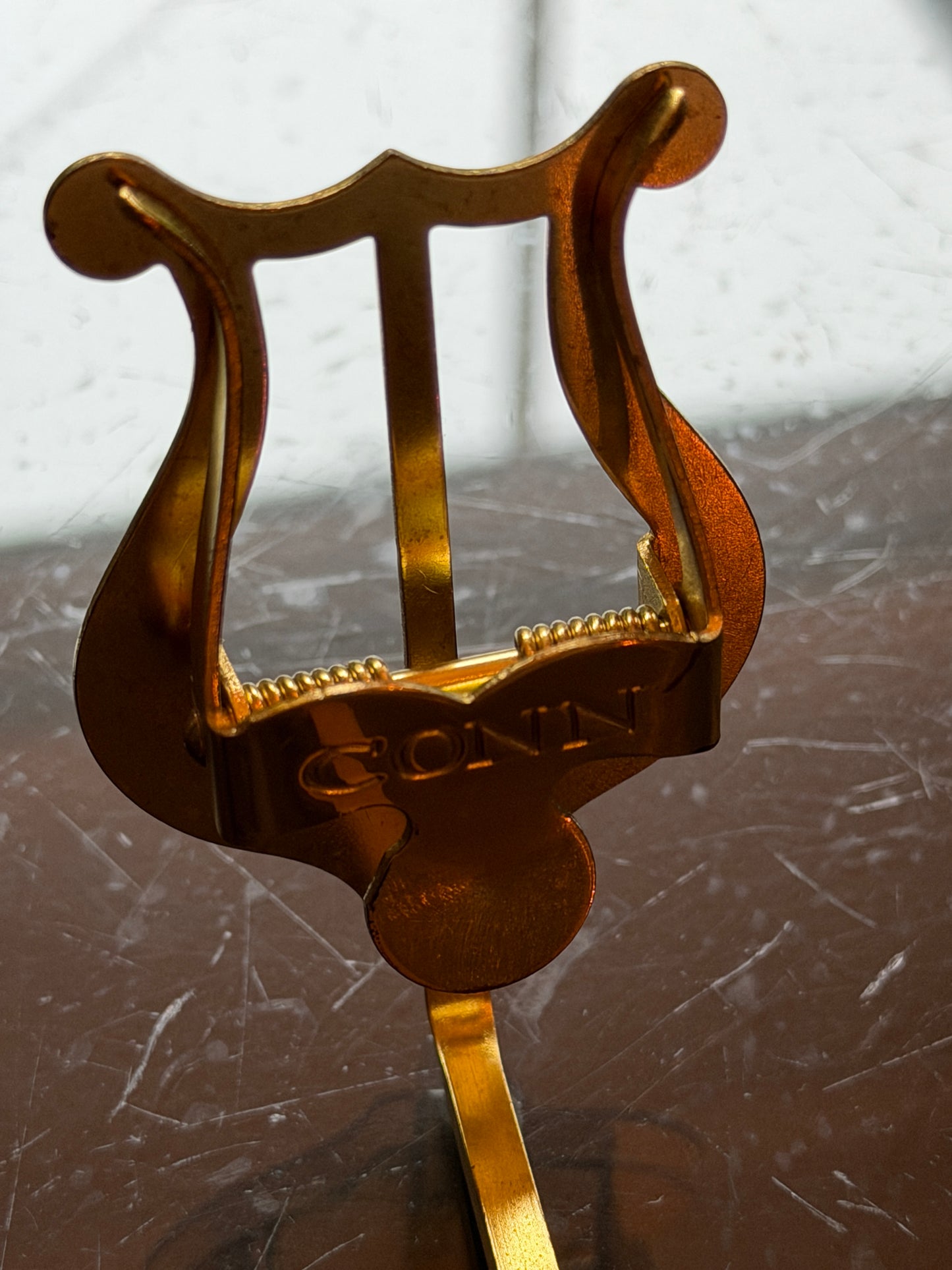 Brass lyre music holder by Conn